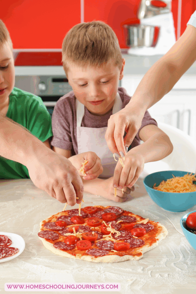 An image that shows kids in the kitchen making pizza.